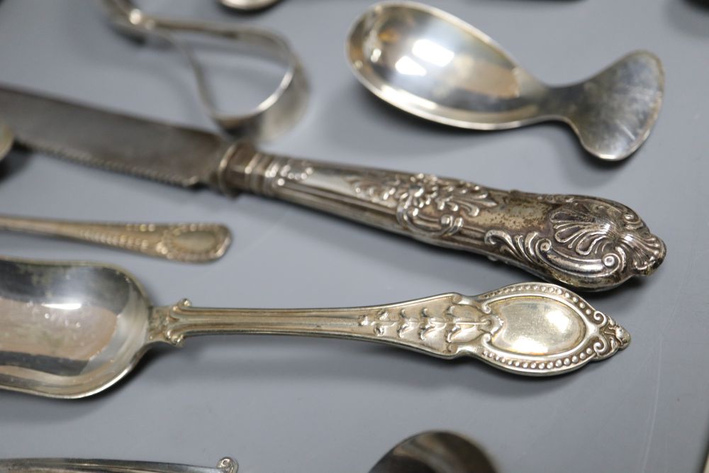 A silver-mounted and ivory page turner and a small collection of silver flatware, Georgian and later,